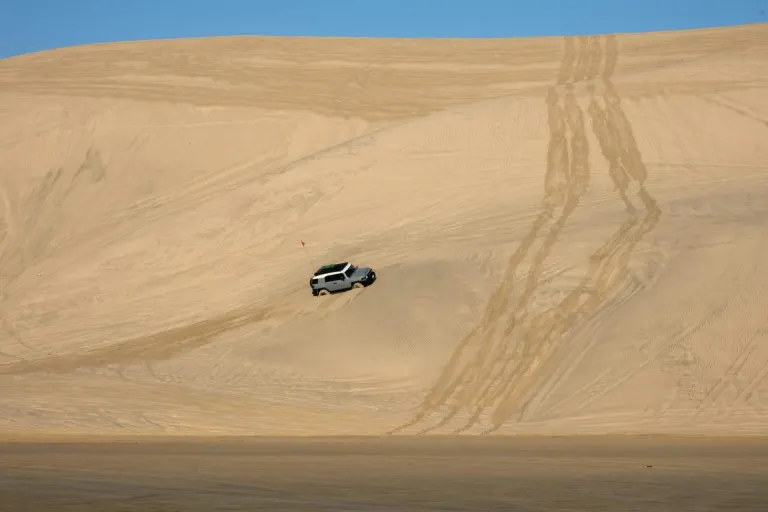 SUV dune bashing on a huge sand dune